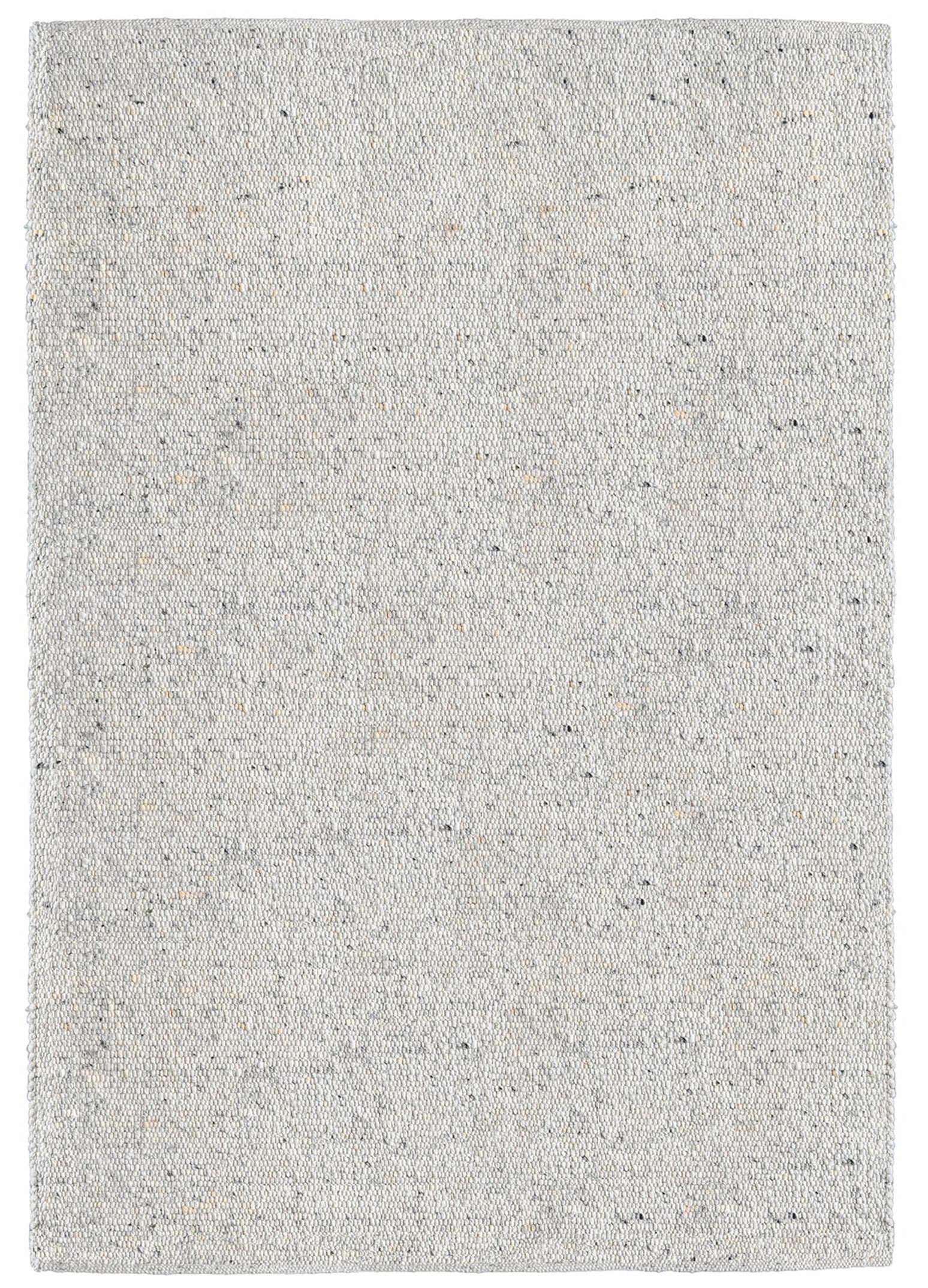 Natūralios vilnos rankų darbos kilimas, kurio tekstūra turi lyg smulkius burbuliukus, o spalva yra šviesiai pilka su keletu pavieniu tamsesniu taškeliu. Makeyourcasa.lt