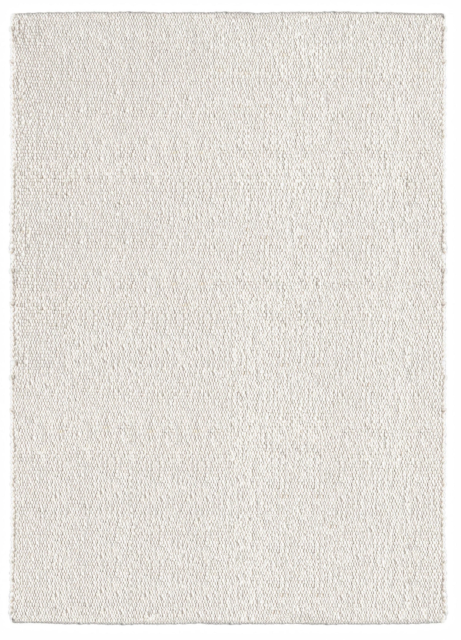 Natūralios vilnos rankų darbo kilimas su mažais burbuliukais, spalva šviesi smėlinė. Mellow Ivory kilimas Makeyourcasa.lt